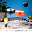 Load image into Gallery viewer, Two cocktail martini glasses with garnishes on a marble surface, featuring a plant and coffee beans.