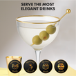 Load image into Gallery viewer, Close-up of Nick and Nora glass with gold rim and olive garnish, highlighting premium ribbed design, handmade quality, and gift-ready style.