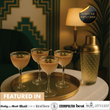 Load image into Gallery viewer, Four Nick and Nora glasses with gold rims, served with olives on cocktail tray alongside gold cocktail shaker, luxury home bar scene.