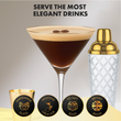 Load image into Gallery viewer, Espresso martini in ribbed martini glass with gold rim beside cocktail shaker.