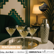 Load image into Gallery viewer, Lifestyle scene with four ribbed martini glasses and silver glass cocktail shaker on tray, elegant home bar setting.