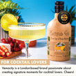 Load image into Gallery viewer, Yellow gin cocktail in ribbed coupe glass with lime garnish beside premium gold cocktail shaker and gin bottle.