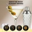 Load image into Gallery viewer, Close-up ribbed martini glass with olives beside silver glass shaker; handmade, hosting-ready, British brand icons.