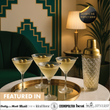 Load image into Gallery viewer, Set of 4 Vemacity ribbed martini glasses with olives on silver tray, styled with gold cocktail shaker, featured in lifestyle magazines.