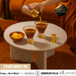 Load image into Gallery viewer, Stylish setup with Vemacity stemless martini glasses and gold jigger on a table, showcasing premium cocktail serve and featured press logos.