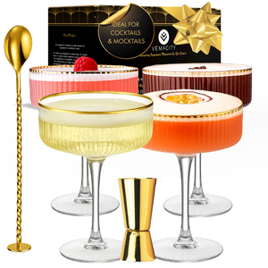 Elegant coupe cocktail glass with gold rim, cocktail and gin gift set