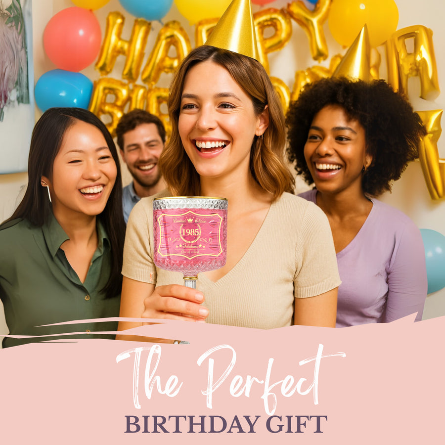 Woman holding 1985 embossed gin glass at birthday party celebration