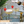 Load image into Gallery viewer, Prosecco being poured into vintage coupe cocktail glasses with gold rim, styled with strawberries
