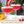 Load image into Gallery viewer, Raspberry cocktail being garnished in coupe cocktail glasses with gold rim, perfect for occasions
