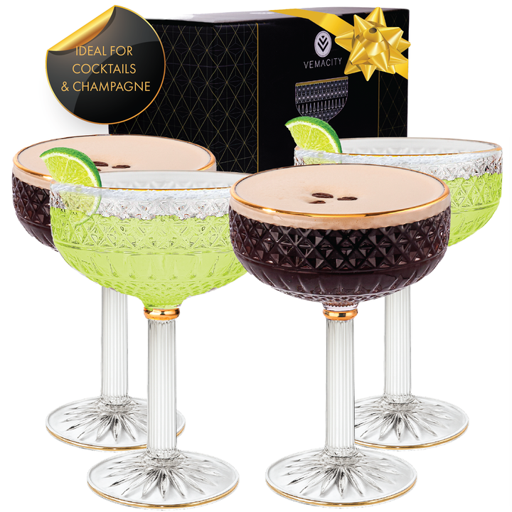 Set of four coupe cocktail glasses with gold rim, styled with espresso martini and margarita