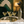 Load image into Gallery viewer, Lifestyle scene with four ribbed martini glasses and silver glass cocktail shaker on tray, elegant home bar setting.

