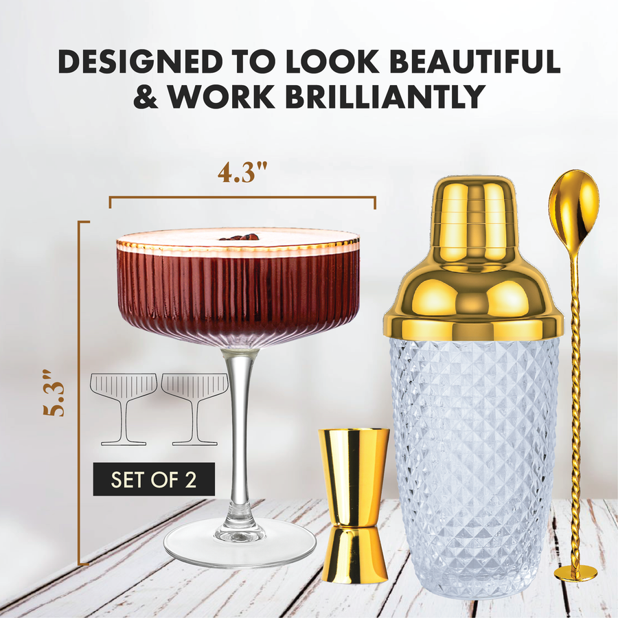 Ribbed coupe glass with gold cocktail shaker and bar tools showing 5.3 inch height and 4.3 inch width.