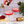 Load image into Gallery viewer, Champagne being poured into red cocktails served in ribbed coupe glasses with gold rim and matching cocktail shaker.
